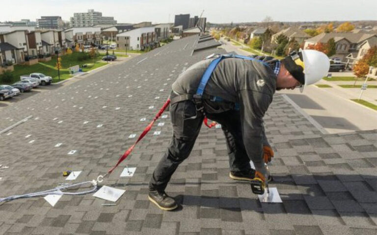 Solar panels being installed on West 5 townhome rooftop