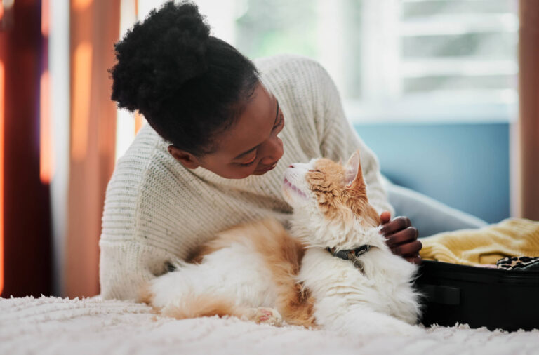 Woman cuddling with her cat